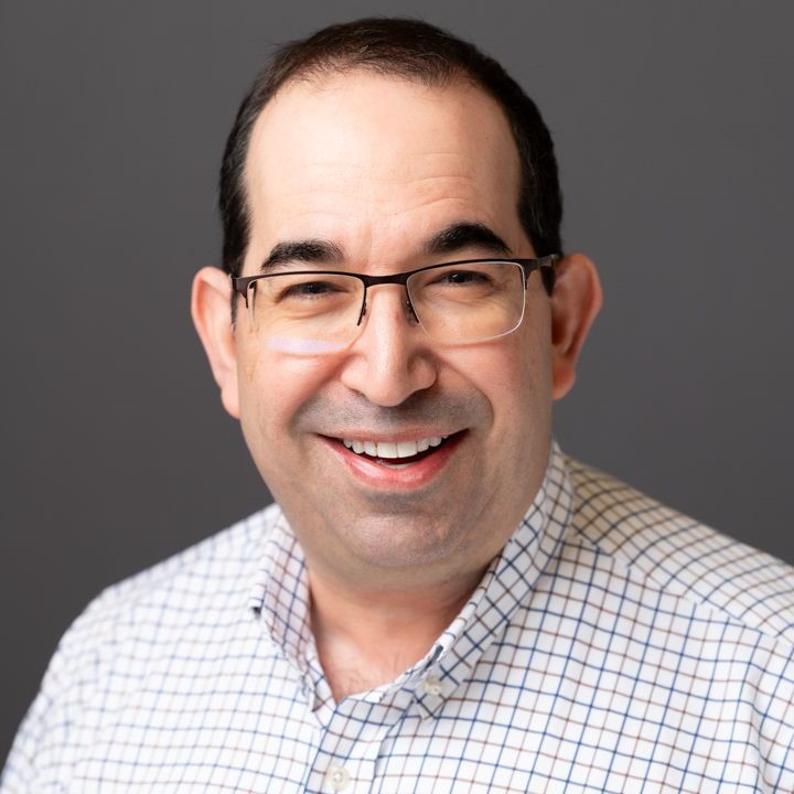 a headshot of Brian LaMacchia against a gray background